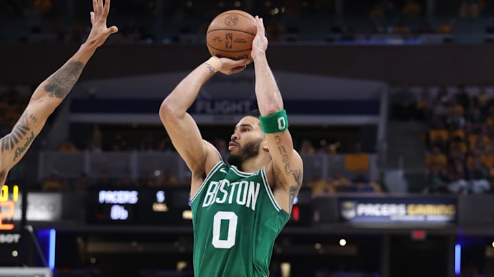 May 25, 2024; Indianapolis, Indiana, USA; Boston Celtics forward Jayson Tatum (0) shoots the ball against Indiana Pacers forward Obi Toppin (1) during the third quarter of game three of the eastern conference finals in the 2024 NBA playoffs at Gainbridge Fieldhouse. Mandatory Credit: Trevor Ruszkowski-Imagn Images
