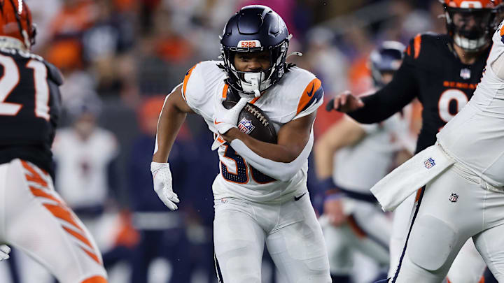 Dec 28, 2024; Cincinnati, Ohio, USA; Denver Broncos running back Jaleel McLaughlin (38) runs for a first down during the fourth quarter against the Cincinnati Bengals at Paycor Stadium. Dec 28, 2024; Cincinnati, Ohio, USA; Denver Broncos running back Jaleel McLaughlin (38) runs for a first down during the fourth quarter against the Cincinnati Bengals at Paycor Stadium.