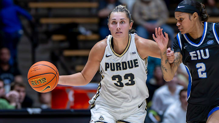 Purdue fifth-year Madison Layden-Zay (33) battles with a defender up the court.