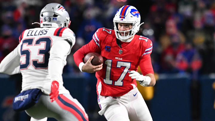 Dec 22, 2024; Orchard Park, New York, USA; Buffalo Bills quarterback Josh Allen (17) tries to avoid New England Patriots linebacker Christian Elliss (53) in the fourth quarter at Highmark Stadium. Mandatory Credit: Mark Konezny-Imagn Images