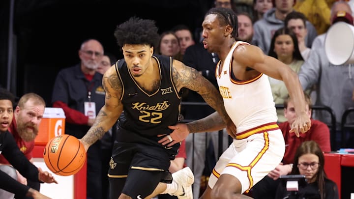 Jan 20, 2026; Ames, Iowa, USA; Iowa State Cyclones guard Jamarion Batemon (1) defends UCF Knights guard Chris Johnson (22) during the first half at James H. Hilton Coliseum. 