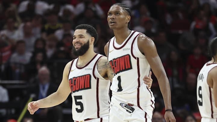 Mar 23, 2025; Houston, Texas, USA; Houston Rockets guard Fred VanVleet (5) and forward Amen Thompson (1) react after a play during the third quarter against the Denver Nuggets at Toyota Center. Mandatory Credit: Troy Taormina-Imagn Images