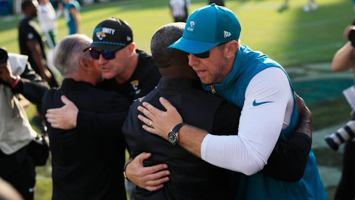 Jacksonville Jaguars head coach Liam Coen hugs New York Jets head coach Aaron Glenn after the game of an NFL football matchup at EverBank Stadium, Sunday, Dec. 14, 2025, in Jacksonville, Fla. The Jaguars defeated the Jets 48-20. [Corey Perrine/Florida Times-Union]