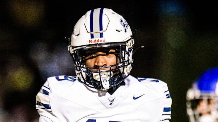 Farmington's Myles Smith celebrates a defensive stop during the Division 2 football district semifinal on Friday, Nov. 1, 2024. Farmington's Myles Smith celebrates a defensive stop during the Division 2 football district semifinal on Friday, Nov. 1, 2024.