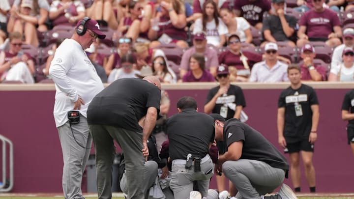 Sep 6, 2025; College Station, Texas, USA; Texas A&M Aggies quarterback Marcel Reed (10) went down with an injury during the second half against the Utah State Aggies at Kyle Field. Mandatory Credit: Sean Thomas-Imagn Images
