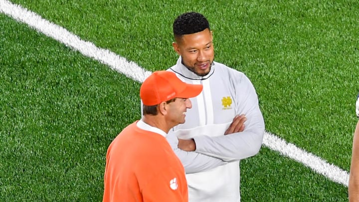 Nov 5, 2022; South Bend, Indiana, USA; Clemson Tigers head coach Dabo Swinney and Notre Dame Fighting Irish head coach Marcus Freeman talk before a game at Notre Dame Stadium. Mandatory Credit: Matt Cashore-Imagn Images