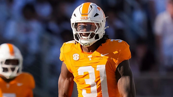Tennessee defensive lineman Caleb Herring flexes after making a play during a college football game between Tennessee and Mississippi State at Davis Wade Stadium.