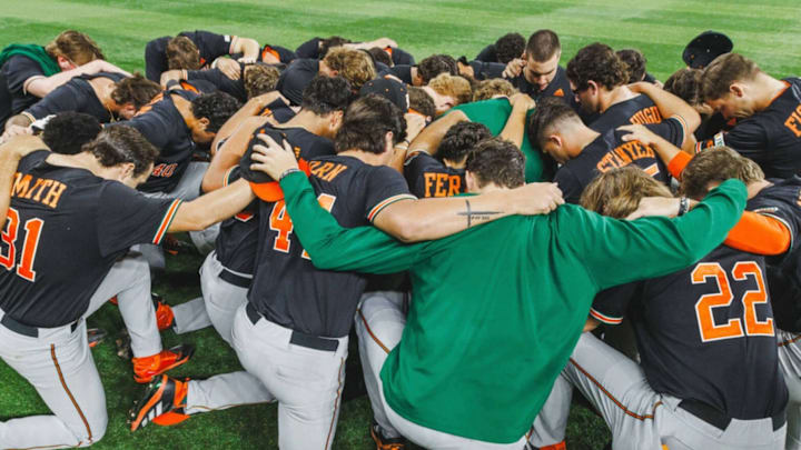 The Miami Hurricanes Baseball team praying after a tough loss against the UCF Knights in Orlando, Fla. The Miami Hurricanes Baseball team praying after a tough loss against the UCF Knights in Orlando, Fla.