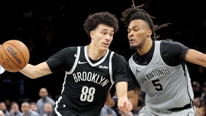 Feb 26, 2026; Brooklyn, New York, USA; Brooklyn Nets guard Nolan Traore (88) drives to the basket against San Antonio Spurs guard Stephon Castle (5) during the third quarter at Barclays Center. Mandatory Credit: Brad Penner-Imagn Images