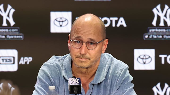 Aug 23, 2023; Bronx, New York, USA; New York Yankees general manager Brian Cashman talks with the media before the game between the Yankees and the Washington Nationals at Yankee Stadium. Mandatory Credit: Vincent Carchietta-Imagn Images