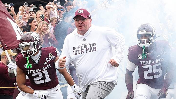 Texas A&M Aggies head coach Mike Elko takes the field prior to the game against the Miami Hurricanes during the first round of the CFP National Playoff at Kyle Field. 