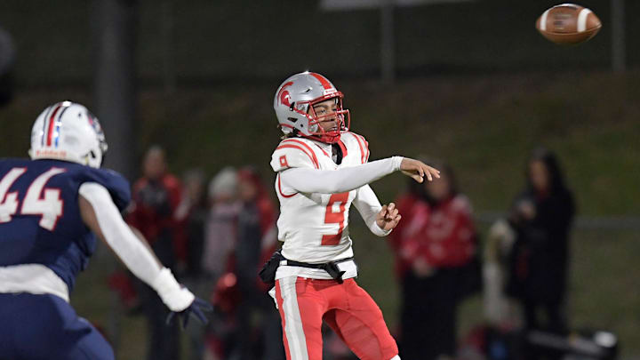 KJ Lacey Jr. passes against Pike Road during their AHSAA football playoff game on the Pike Road High School campus in Pike Road, Ala., Friday evening November 29, 2024.