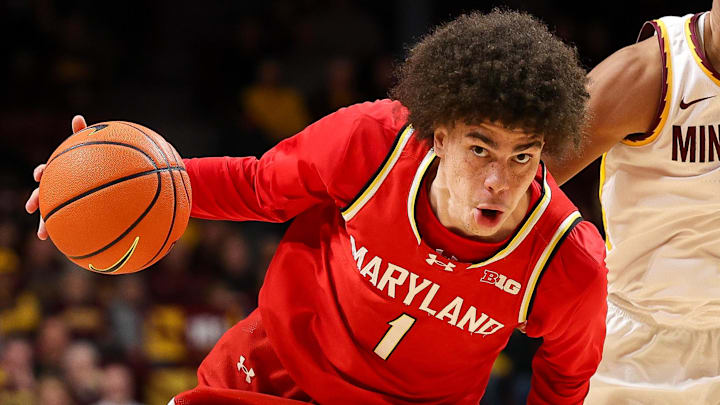 Feb 8, 2026; Minneapolis, Minnesota, USA; Maryland Terrapins guard Darius Adams (1) works around Minnesota Golden Gophers guard Isaac Asuma (1) during the second half at Williams Arena. Mandatory Credit: Matt Krohn-Imagn Images