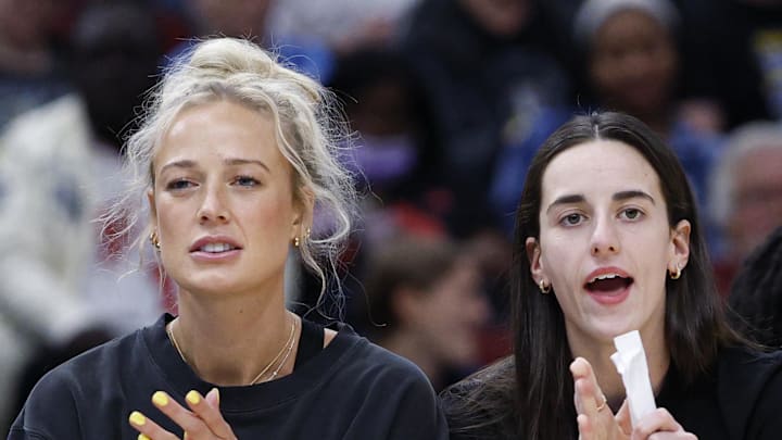 Jun 7, 2025; Chicago, Illinois, USA; Injured Indiana Fever guard Sophie Cunningham (8) and guard Caitlin Clark (22) react from the bench during the first half of a WNBA game against the Chicago Sky at United Center. Mandatory Credit: Kamil Krzaczynski-Imagn Images