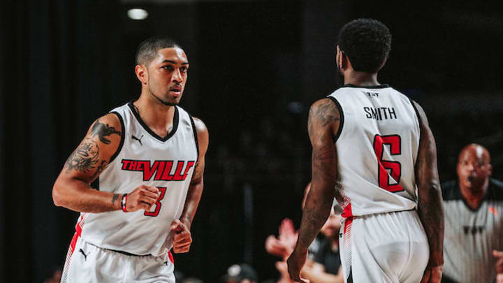 The Ville guards Peyton Siva (3) and Russ Smith (6)