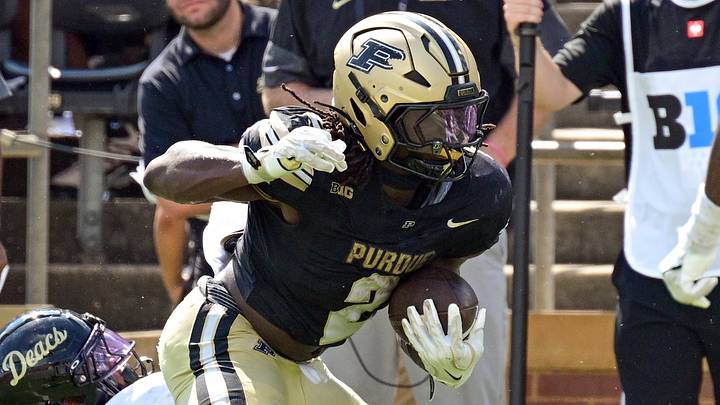 Purdue Boilermakers running back Fame Ijeboi (2) evades a tackle. Purdue Boilermakers running back Fame Ijeboi (2) evades a tackle.