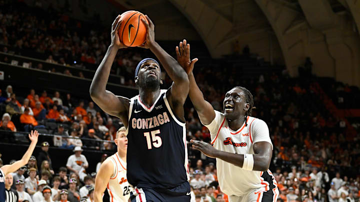 Feb 7, 2026; Corvallis, Oregon, USA; Gonzaga Bulldogs forward Graham Ike (15) drives against Oregon State Beavers center Yaak Yaak (4).