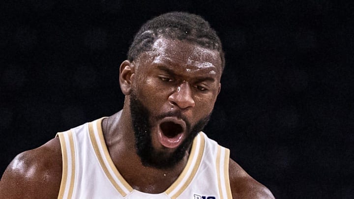 Washington Huskies center Franck Kepnang (11) celebrates a defensive play during the second half of their game in the Acrisure Series in Palm Desert, Calif., Thursday, Nov. 27, 2025.