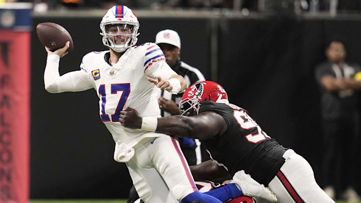 Oct 13, 2025; Atlanta, Georgia, USA; Atlanta Falcons defensive tackle David Onyemata (90) and defensive tackleSam Roberts (99) applie the pressure on Buffalo Bills quarterback Josh Allen (17) who is looking to show downfield during the second half of a game at Mercedes-Benz Stadium. Mandatory Credit: Dale Zanine-Imagn Images