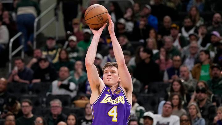 Nov 15, 2025; Milwaukee, Wisconsin, USA; Los Angeles Lakers guard Dalton Knecht (4) shoots during the third quarter against the Milwaukee Bucks at Fiserv Forum. Mandatory Credit: Jeff Hanisch-Imagn Images Nov 15, 2025; Milwaukee, Wisconsin, USA; Los Angeles Lakers guard Dalton Knecht (4) shoots during the third quarter against the Milwaukee Bucks at Fiserv Forum. Mandatory Credit: Jeff Hanisch-Imagn Images