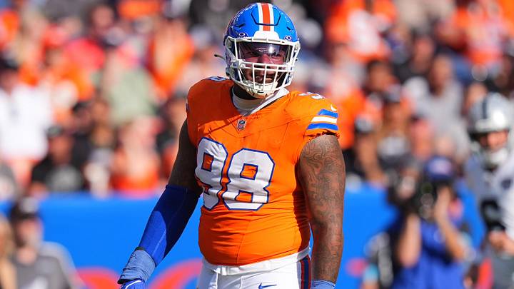 Oct 6, 2024; Denver, Colorado, USA; Denver Broncos defensive end John Franklin-Myers (98) reacts to a defensive stop in the second half against the Las Vegas Raiders at Empower Field at Mile High. 