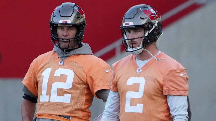 Nov 11, 2022; Munich, Germany; Tampa Bay Buccaneers quarterbacks Tom Brady (12) and Kyle Trask (2) react during practice at the FC Bayern Campus. Mandatory Credit: Kirby Lee-Imagn Images Nov 11, 2022; Munich, Germany; Tampa Bay Buccaneers quarterbacks Tom Brady (12) and Kyle Trask (2) react during practice at the FC Bayern Campus. Mandatory Credit: Kirby Lee-Imagn Images