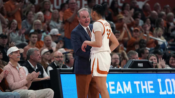 Feb 22, 2026; Austin, Texas, USA; Texas Longhorns head coach Vic Schaefer congratulates forward Teya Sidberry (32) during the second half at Moody Center. Mandatory Credit: Dustin Safranek-Imagn Images