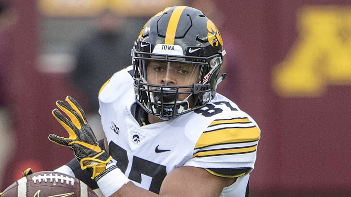 Oct 6, 2018; Minneapolis, MN, USA; Iowa Hawkeyes tight end Noah Fant (87) rushes for a first down after making a catch in the first half against the Minnesota Golden Gophers at TCF Bank Stadium. Mandatory Credit: Jesse Johnson-Imagn Images