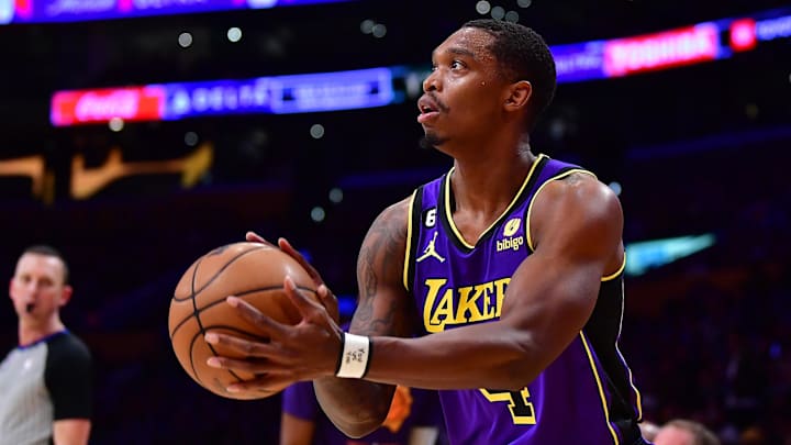 Apr 7, 2023; Los Angeles, California, USA; Los Angeles Lakers guard Lonnie Walker IV (4) shoots against the Phoenix Suns during the first half at Crypto.com Arena. Mandatory Credit: Gary A. Vasquez-Imagn Images
