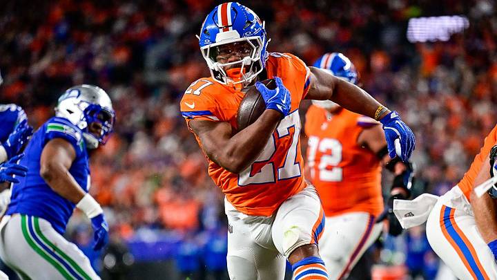 DENVER, CO - OCTOBER 15: Denver Broncos running back J.K. Dobbins 27 runs and scores a second quarter touchdown during a game between the Seattle Seahawks and the Denver Broncos at Empower Field at Mile High on October 15, 2026 in Denver, Colorado. DENVER, CO - OCTOBER 15: Denver Broncos running back J.K. Dobbins 27 runs and scores a second quarter touchdown during a game between the Seattle Seahawks and the Denver Broncos at Empower Field at Mile High on October 15, 2026 in Denver, Colorado.