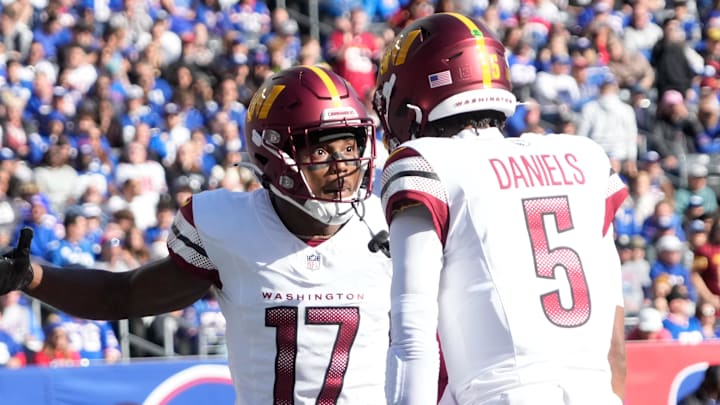 Nov 3, 2024; East Rutherford, New Jersey, USA; Washington Commanders wide receiver Terry McLaurin (17) after a 1st quarter towchdown reception from quarterback Jayden Daniels (5) against the New York Giants at MetLife Stadium. Mandatory Credit: Robert Deutsch-Imagn Images Nov 3, 2024; East Rutherford, New Jersey, USA; Washington Commanders wide receiver Terry McLaurin (17) after a 1st quarter towchdown reception from quarterback Jayden Daniels (5) against the New York Giants at MetLife Stadium. Mandatory Credit: Robert Deutsch-Imagn Images