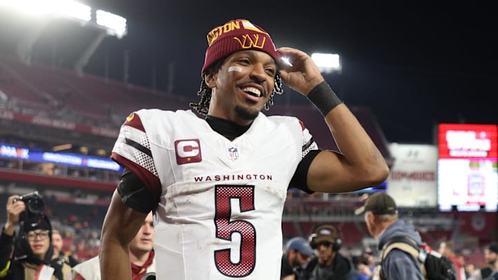 Jan 12, 2025; Tampa, Florida, USA; Washington Commanders quarterback Jayden Daniels (5) celebrates after winning a NFC wild card playoff against the Tampa Bay Buccaneers at Raymond James Stadium. Mandatory Credit: Nathan Ray Seebeck-Imagn Images