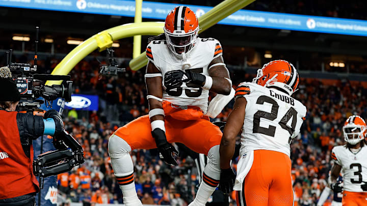 Dec 2, 2024; Denver, Colorado, USA; Cleveland Browns tight end David Njoku (85) spikes the ball next to running back Nick Chubb (24) after scoring a touchdown against the Denver Broncos at Empower Field at Mile High. Mandatory Credit: Isaiah J. Downing-Imagn Images