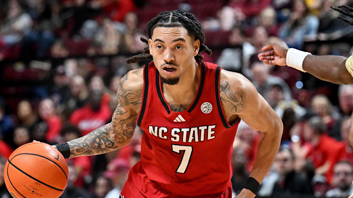 Jan 10, 2026; Tallahassee, Florida, USA; North Carolina State Wolfpack guard Alyn Breed (7) drives to the net against the Florida State Seminoles during the first half at Donald L. Tucker Center. Mandatory Credit: Melina Myers-Imagn Images