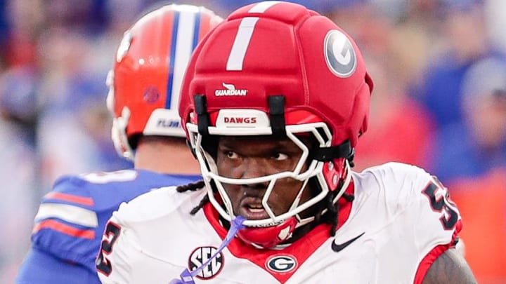 Georgia Bulldogs defensive lineman Christen Miller (52) reacts after making a tackle against the Florida Gators. Georgia Bulldogs defensive lineman Christen Miller (52) reacts after making a tackle against the Florida Gators.