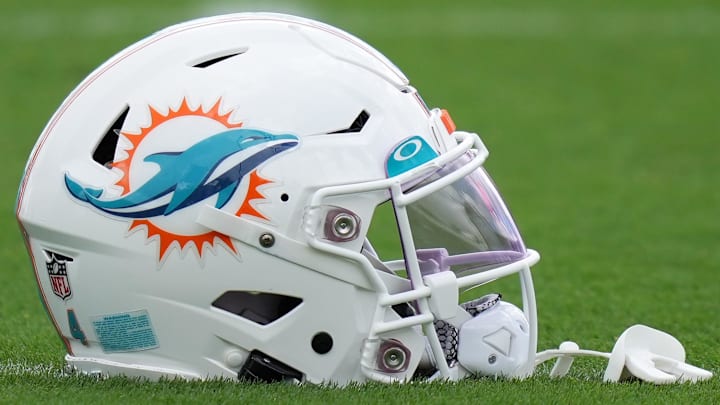 Aug 3, 2022; Miami Gardens, Florida, US; A general view of a Miami Dolphins helmet on the field during training camp at Baptist Health Training Complex. Mandatory Credit: Jasen Vinlove-Imagn Images