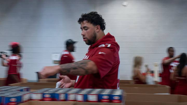 Cardinal rookie OL Chase Bisontis helps assemble food bags at the United Food Bank in Mesa, on May 15, 2026.