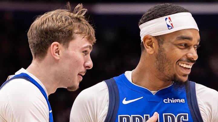 Mar 16, 2026; New Orleans, Louisiana, USA;  Dallas Mavericks forward Cooper Flagg (32) shares a moment with forward P.J. Washington (25) against the New Orleans Pelicans during the first half at Smoothie King Center. Mandatory Credit: Stephen Lew-Imagn Images