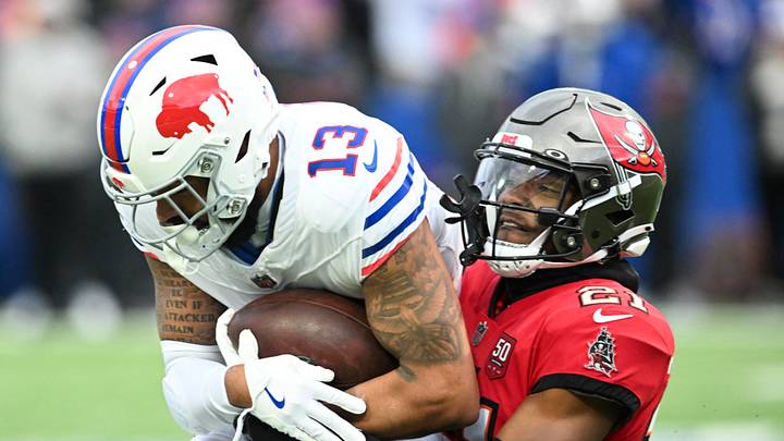 Tampa Bay Buccaneers cornerback Benjamin Morrison (21) tackles Buffalo Bills wide receiver Gabe Davis (13) Tampa Bay Buccaneers cornerback Benjamin Morrison (21) tackles Buffalo Bills wide receiver Gabe Davis (13)