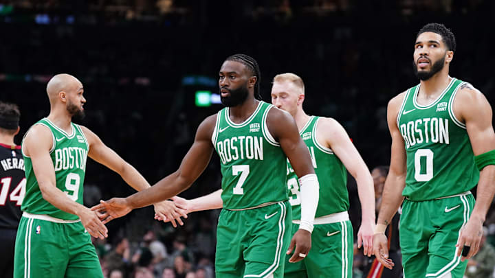 Apr 24, 2024; Boston, Massachusetts, USA; Boston Celtics guard Jaylen Brown (7), forward Jayson Tatum (0), guard Derrick White (9) and forward Sam Hauser (30) walk to the bench during a timeout against the Miami Heat in the second quarter during game two of the first round for the 2024 NBA playoffs at TD Garden. Mandatory Credit: David Butler II-Imagn Images
