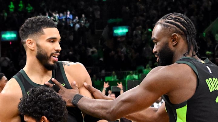 Nov 16, 2024; Boston, Massachusetts, USA; Boston Celtics forward Jayson Tatum (0) celebrates with guard Jaylen Brown (7) after making the game wining basket against the Toronto Raptors in overtime at the TD Garden. Mandatory Credit: Brian Fluharty-Imagn Images
