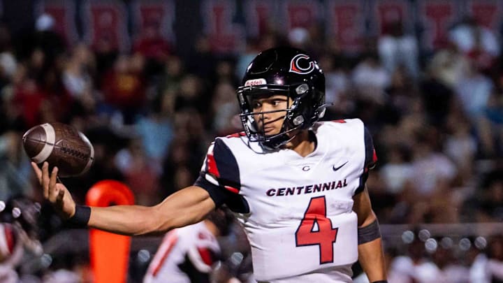 Centennial Huskies Quarterback Husan Longstreet (4) catches the ball at Liberty High School on Sept. 21, 2024, in Peoria.