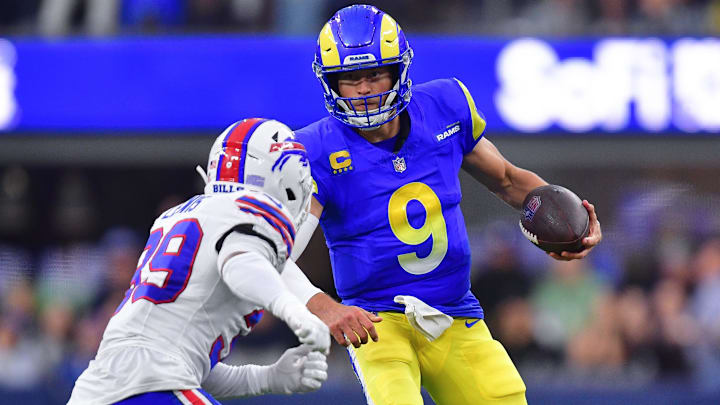 Dec 8, 2024; Inglewood, California, USA; Los Angeles Rams quarterback Matthew Stafford (9) runs the ball against Buffalo Bills cornerback Cam Lewis (39) during the second half at SoFi Stadium. Mandatory Credit: Gary A. Vasquez-Imagn Images