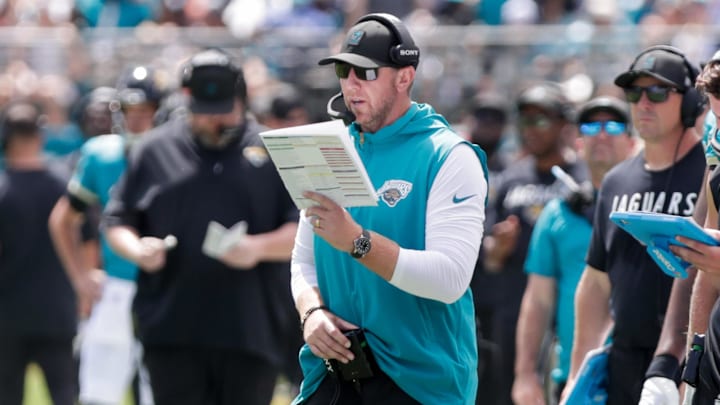 Sep 21, 2025; Jacksonville, Florida, USA; Jacksonville Jaguars head coach Liam Coen reads a play during the second quarter against the Houston Texans at EverBank Stadium. Mandatory Credit: Travis Register-Imagn Images