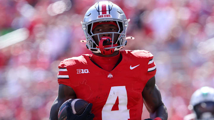 Sep 21, 2024; Columbus, Ohio, USA;  Ohio State Buckeyes wide receiver Jeremiah Smith (4) breaks away for a touchdown during the third quarter against the Marshall Thundering Herd at Ohio Stadium. Mandatory Credit: Joseph Maiorana-Imagn Images