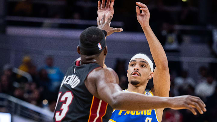 Mar 29, 2026; Indianapolis, Indiana, USA; Indiana Pacers guard Andrew Nembhard (2) shoots the ball while Miami Heat center Bam Adebayo (13) defends in the first half at Gainbridge Fieldhouse. Mandatory Credit: Trevor Ruszkowski-Imagn Images