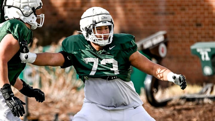 Michigan State offensive lineman Rustin Young, right, and Stanton Ramil work out during football practice on Tuesday, April 8, 2025, in East Lansing. Michigan State offensive lineman Rustin Young, right, and Stanton Ramil work out during football practice on Tuesday, April 8, 2025, in East Lansing.