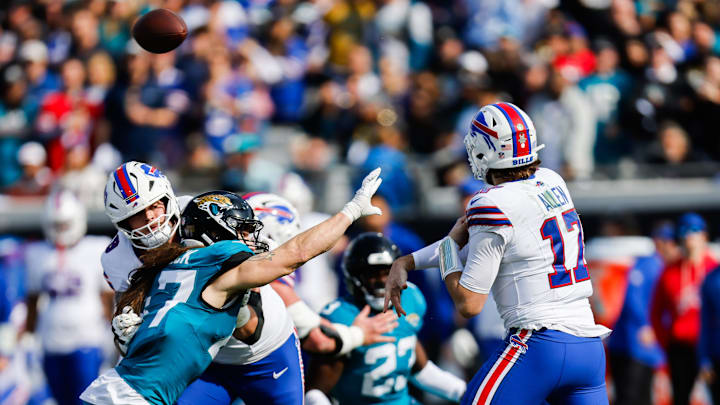 Jacksonville Jaguars linebacker Dennis Gardeck (47) pressures Buffalo Bills quarterback Josh Allen (17) during the first quarter in an NFL football AFC Wild Card playoff matchup, Sunday, Jan. 11, 2026, in Jacksonville, Fla. Bills lead 10-7 at the half over the Jaguars. [Doug Engle/Florida Times-Union]