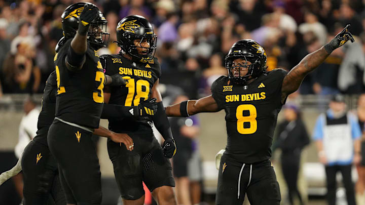 Sep 26, 2025; Tempe, Arizona, USA; Arizona State Sun Devils linebacker Martell Hughes (18) celebrates game winning interception with teammates defensive lineman Prince Dorbah (32) defensive back Rodney Bimage Jr. (0) and linebacker Jordan Crook (8) against TCU Horned Frogs in the second half at Mountain America Stadium, Home of the ASU Sun Devils. Mandatory Credit: Jacob Reiner-Imagn Images Sep 26, 2025; Tempe, Arizona, USA; Arizona State Sun Devils linebacker Martell Hughes (18) celebrates game winning interception with teammates defensive lineman Prince Dorbah (32) defensive back Rodney Bimage Jr. (0) and linebacker Jordan Crook (8) against TCU Horned Frogs in the second half at Mountain America Stadium, Home of the ASU Sun Devils. Mandatory Credit: Jacob Reiner-Imagn Images