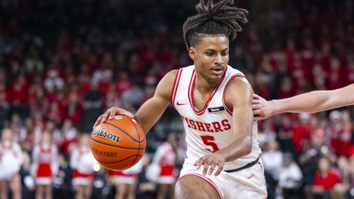 Fishers High School sophomore Jason Gardner (5) drives the ball against the defense 
